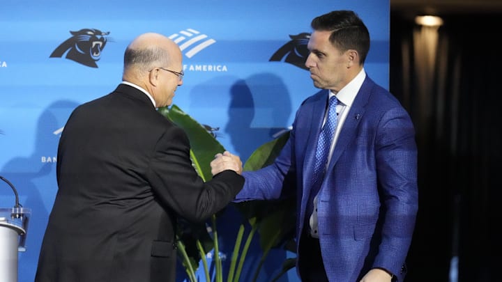 Feb 1, 2024; Charlotte, NC, USA; Carolina Panthers team owner David Tepper greets Dan Morgan during the introductory press conference for new general manager Dan Morgan and head coach Dave Canales at Bank of America Stadium. 