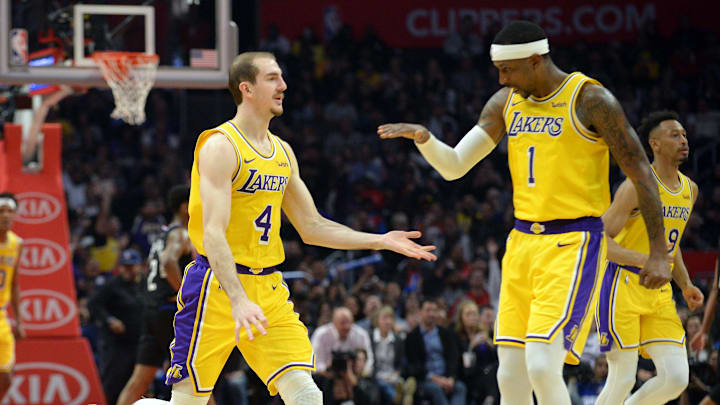 April 5, 2019; Los Angeles, CA, USA; Los Angeles Lakers guard Alex Caruso (4) celebrates with guard Kentavious Caldwell-Pope (1) after scoring a three point basket against the Los Angeles Clippers during the second half at Staples Center. Mandatory Credit: Gary A. Vasquez-Imagn Images