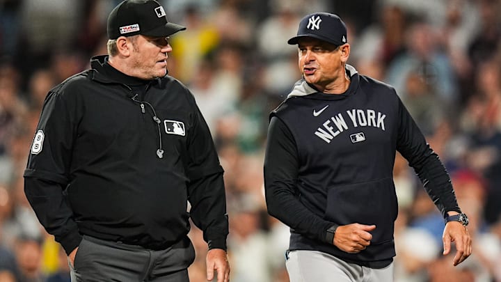 Jun 13, 2025; Boston, Massachusetts, USA; New York Yankees manager Aaron Boone (17) has words with the officials as they take on the Boston Red Sox in the tenth inning at Fenway Park. Mandatory Credit: David Butler II-Imagn Images