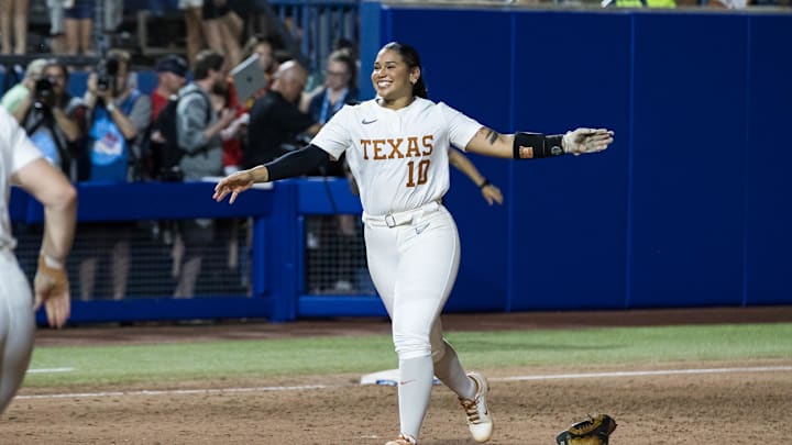 Jun 6, 2025; Oklahoma City, OK, USA;  Texas Longhorns utility Mia Scott (10) runs towards her team to celebrate their win over the Texas Tech Red Raiders 10-4 to win the National Championship in game three of the NCAA Softball Women's College World Series finals at Devon Park. Mandatory Credit: Brett Rojo-Imagn Images