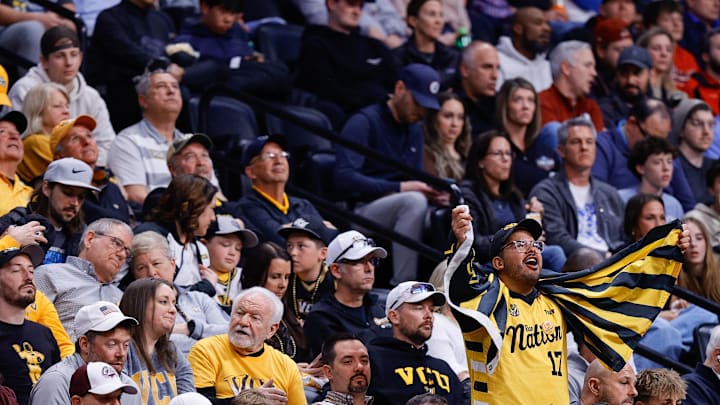 Mar 20, 2025; Denver, CO, USA; A fan for VCU Rams cheers during the second half against the Brigham Young Cougars in the first round of the NCAA Tournament at Ball Arena. Mandatory Credit: Isaiah J. Downing-Imagn Images