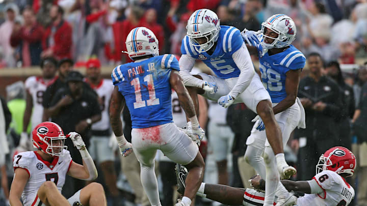 Nov 9, 2024; Oxford, Mississippi, USA; Mississippi Rebels defensive back John Saunders Jr. (5) reacts with linebacker Chris Paul Jr. (11) after a defensive stop during the first half against the Georgia Bulldogs at Vaught-Hemingway Stadium. Mandatory Credit: Petre Thomas-Imagn Images Nov 9, 2024; Oxford, Mississippi, USA; Mississippi Rebels defensive back John Saunders Jr. (5) reacts with linebacker Chris Paul Jr. (11) after a defensive stop during the first half against the Georgia Bulldogs at Vaught-Hemingway Stadium. Mandatory Credit: Petre Thomas-Imagn Images