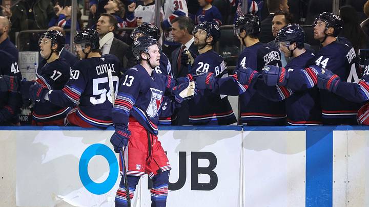 Oct 11, 2026; New York, New York, USA;  New York Rangers left wing Alexis Lafreniere (13) celebrates with his teammates after scoring a goal in the third period against the Vancouver Canucks at Madison Square Garden.  Mandatory Credit: Wendell Cruz-Imagn Images