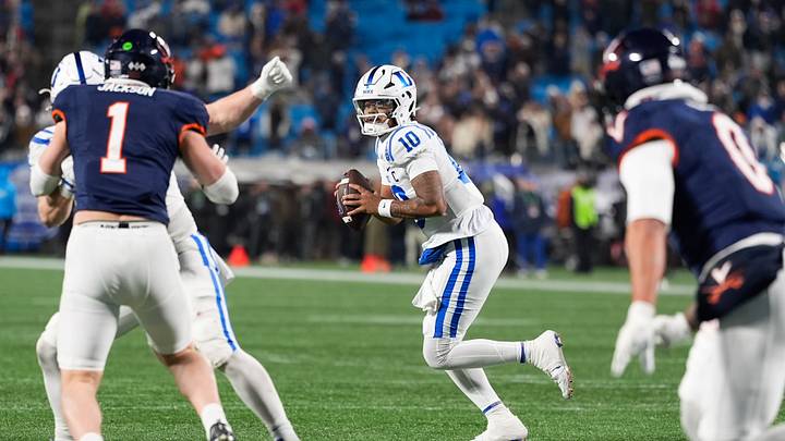 Dec 6, 2025; Charlotte, NC, USA; Duke Blue Devils quarterback Darian Mensah (10) looks to pass during over time against the Virginia Cavaliers during the 2025 ACC Championship game at Bank of America Stadium. Mandatory Credit: Jim Dedmon-Imagn Images Dec 6, 2025; Charlotte, NC, USA; Duke Blue Devils quarterback Darian Mensah (10) looks to pass during over time against the Virginia Cavaliers during the 2025 ACC Championship game at Bank of America Stadium. Mandatory Credit: Jim Dedmon-Imagn Images