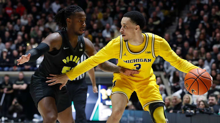 Purdue Boilermakers guard Lance Jones (55) defends Michigan Wolverines guard Jaelin Llewellyn (3)