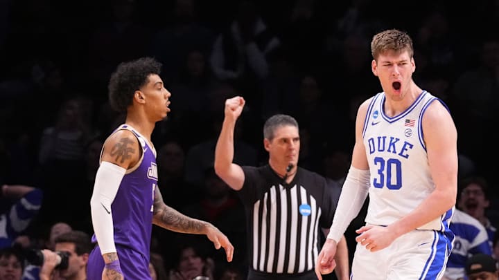 Mar 24, 2024; Brooklyn, NY, USA; Duke Blue Devils center Kyle Filipowski (30) reacts against the