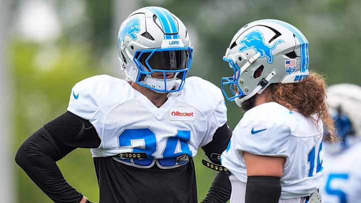 Detroit Lions linebackers Alex Anzalone (34) and Grant Stuard (15) talk during training camp at Meijer Performance Center in Allen Park on Saturday, July 26, 2025.