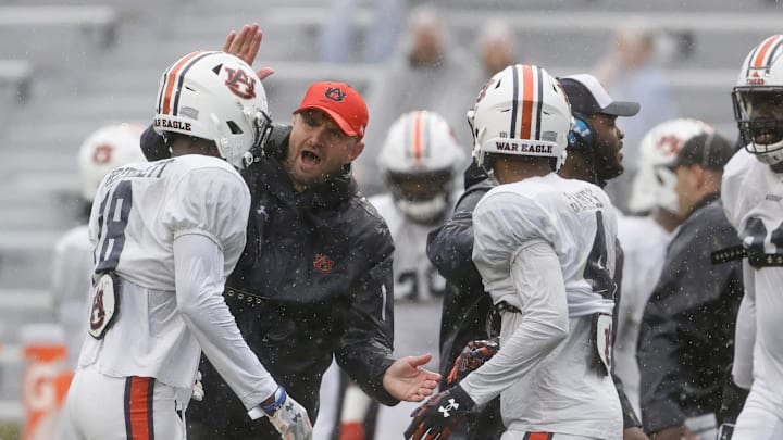 Apr 8, 2023; Auburn, AL, USA;  Auburn Tigers linebackers coach Josh Aldridge celebrates with cornerback Nehemiah Pritchett (18) during the annual Auburn Spring Game at Jordan-Hare Stadium. Mandatory Credit: John Reed-Imagn Images