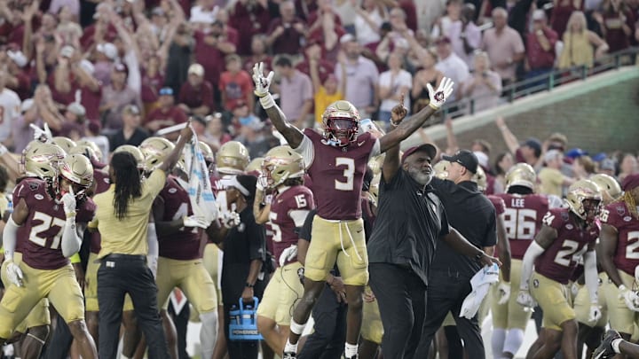 Aug 30, 2025; Tallahassee, Florida, USA; Florida State Seminoles running back Kam Davis (3) and associate head coach Odell Haggins react after a play Alabama Crimson Tide during the second half at Doak S. Campbell Stadium. Mandatory Credit: Melina Myers-Imagn Images
