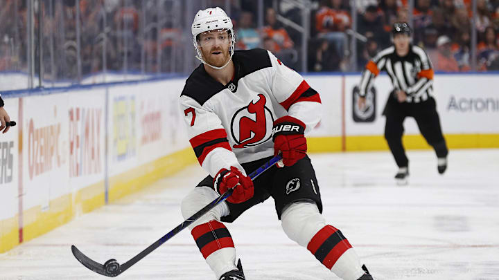 New Jersey Devils defensemen Dougie Hamilton (7) dumps the puck in against the Edmonton Oilers at Rogers Place.
