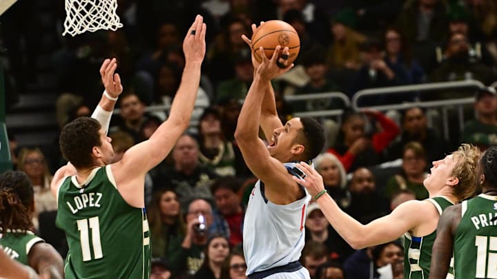 Dec 21, 2024; Milwaukee, Wisconsin, USA; Washington Wizards guard Malcolm Brogdon (15) shoots the ball against Milwaukee Bucks center Brook Lopez (11) in the second quarter at Fiserv Forum. Mandatory Credit: Benny Sieu-Imagn Images Dec 21, 2024; Milwaukee, Wisconsin, USA; Washington Wizards guard Malcolm Brogdon (15) shoots the ball against Milwaukee Bucks center Brook Lopez (11) in the second quarter at Fiserv Forum. Mandatory Credit: Benny Sieu-Imagn Images
