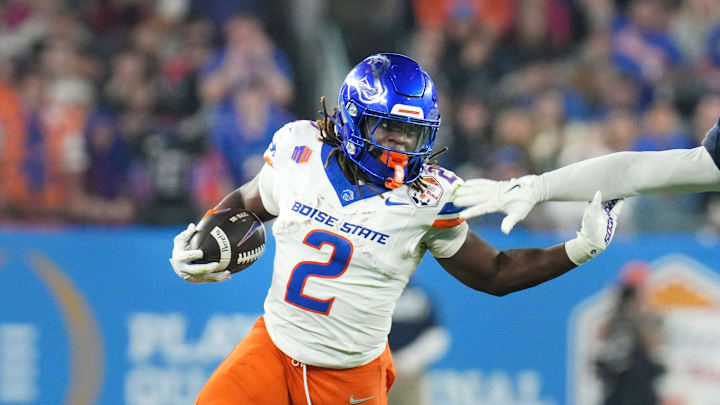 Boise State Broncos running back Ashton Jeanty (2) runs past Penn State Nittany Lions linebacker Kobe King (41) during their Vrbo Fiesta Bowl matchup at State Farm Stadium on Dec. 31, 2024. Boise State Broncos running back Ashton Jeanty (2) runs past Penn State Nittany Lions linebacker Kobe King (41) during their Vrbo Fiesta Bowl matchup at State Farm Stadium on Dec. 31, 2024.