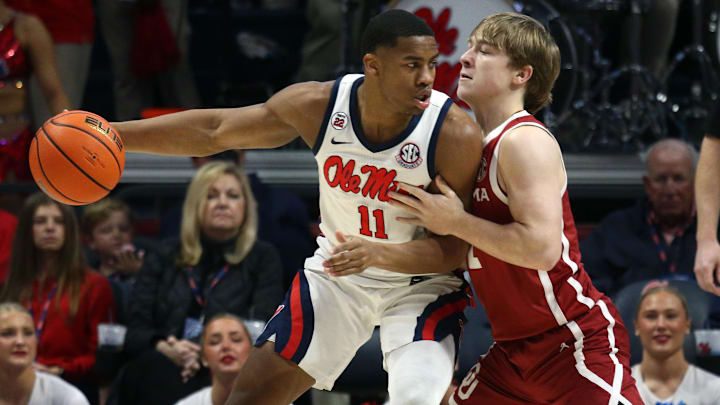 Mar 1, 2025; Oxford, Mississippi, USA; Mississippi Rebels guard Matthew Murrell (11) dribbles as Oklahoma Sooners guard Dayton Forsythe (7) defends during the first half at The Sandy and John Black Pavilion at Ole Miss. Mandatory Credit: Petre Thomas-Imagn Images