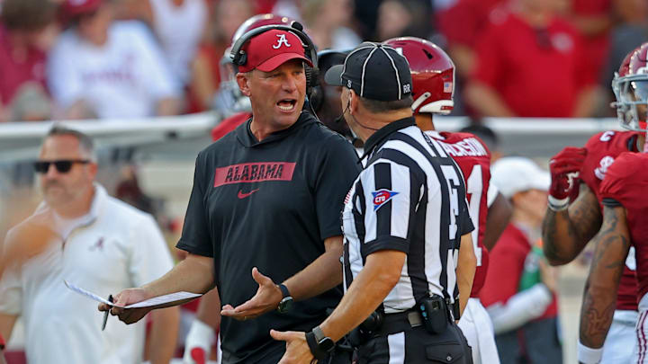 Head coach Kalen Deboer argues with referee
