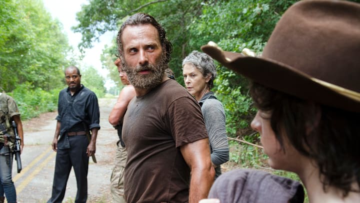 Seth Gilliam as Father Gabriel, Andrew Lincoln as Rick Grimes, Melissa McBride as Carol Peletier, and Chandler Riggs as Carl Grimes in The Walking Dead season 5