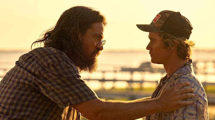 Outer Banks. (L to R) Charles Halford as Big John, Chase Stokes as John B in episode 304 of Outer Banks. Cr. Jackson Lee Davis/Netflix © 2023