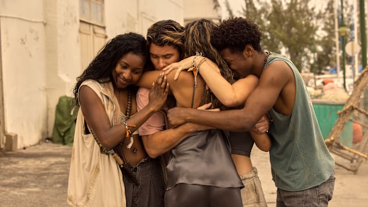 Outer Banks. (L to R) Carlacia Grant as Cleo, Chase Stokes as John B, Madison Bailey as Kiara, Jonathan Daviss as Pope in episode 302 of Outer Banks. Cr. Jackson Lee Davis/Netflix © 2023