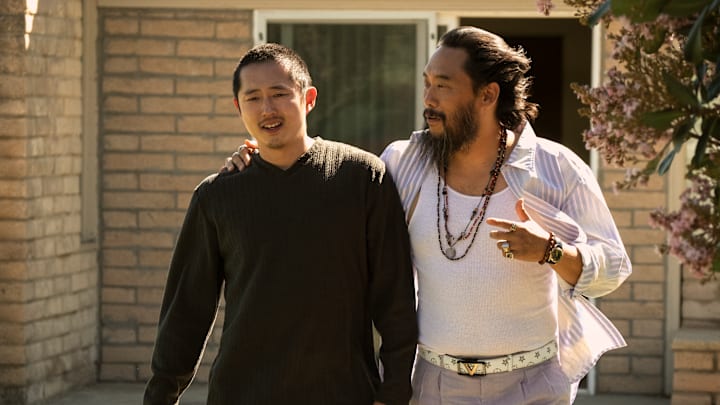 Beef. (L to R) Steven Yeun as Danny, David Choe as Isaac in episode 106 of Beef. Cr. Andrew Cooper/Netflix © 2023 Beef. (L to R) Steven Yeun as Danny, David Choe as Isaac in episode 106 of Beef. Cr. Andrew Cooper/Netflix © 2023