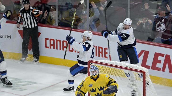 Feb 15, 2025; Montreal, Quebec, CAN; [Imagn Images direct customers only] Team Finland forward Mikael Granlund (64) celebrates afterscoring the winning goal against Team Sweden goalie Linus Ullmark (35) in the overtime period during a 4 Nations Face-Off ice hockey game at the Bell Centre. Mandatory Credit: Eric Bolte-Imagn Images
