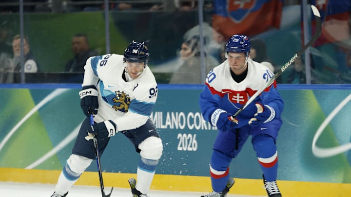 Feb 11, 2026; Milan, Italy; Mikko Rantanen of Finland in action with Juraj Slafkovsky of Slovakia in men's ice hockey group B play during the Milano Cortina 2026 Olympic Winter Games at Milano Santagiulia Ice Hockey Arena. Mandatory Credit: Geoff Burke-Imagn Images Feb 11, 2026; Milan, Italy; Mikko Rantanen of Finland in action with Juraj Slafkovsky of Slovakia in men's ice hockey group B play during the Milano Cortina 2026 Olympic Winter Games at Milano Santagiulia Ice Hockey Arena. Mandatory Credit: Geoff Burke-Imagn Images