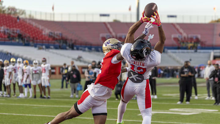 Jan 29, 2026; Mobile, AL, USA; American wide receiver Cyrus Allen (13) of Cincinnati grabs a pass with American cornerback Ephesians Prysock (21) of Washington defending during American Senior Bowl practice at Hancock Whitney Stadium. Mandatory Credit: Vasha Hunt-Imagn Images