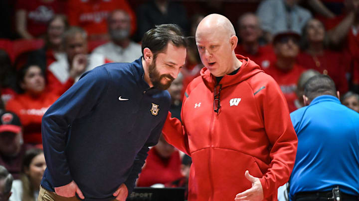 Marquette head coach Tom Mendoza (left) talks with Wisconsin coach Kelly Sheffield during a break in a spring match Wednesday, April 16, 2025, at the UW Field House in Madison, Wisconsin.