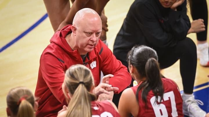 Wisconsin coach Kelly Sheffield talks to players during a timeout in a spring match against Marquette on Monday, March 23, 2026, at the Al McGuire Center in Milwaukee, Wisconsin.