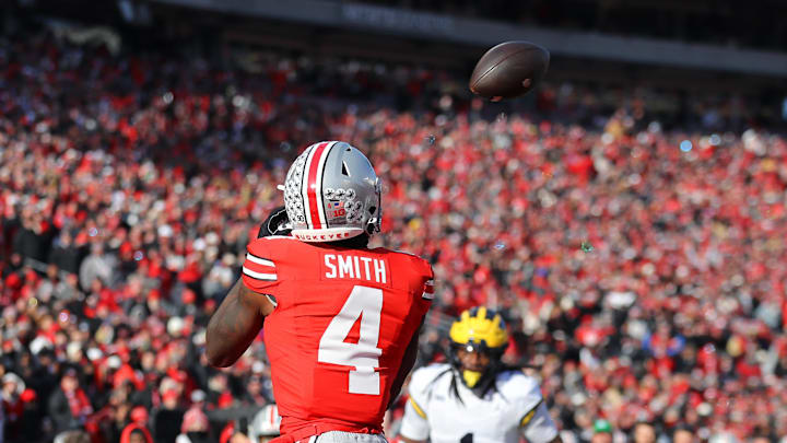 Nov 30, 2024; Columbus, Ohio, USA; Ohio State Buckeyes wide receiver Jeremiah Smith (4) catches the touchdown pass during the second quarter against the Michigan Wolverines at Ohio Stadium. Mandatory Credit: Joseph Maiorana-Imagn Images