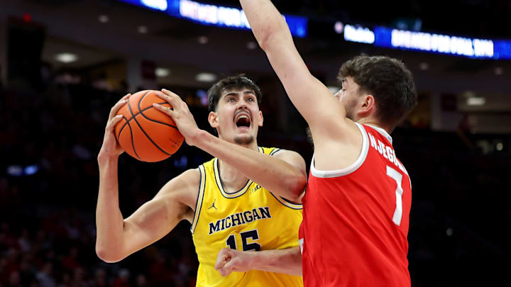 Feb 8, 2026; Columbus, Ohio, USA;  Michigan Wolverines center Aday Mara (15) drives to the basket as Ohio State Buckeyes center Ivan Njegovan (7) defends during the first half at Value City Arena. Mandatory Credit: Joseph Maiorana-Imagn Images
