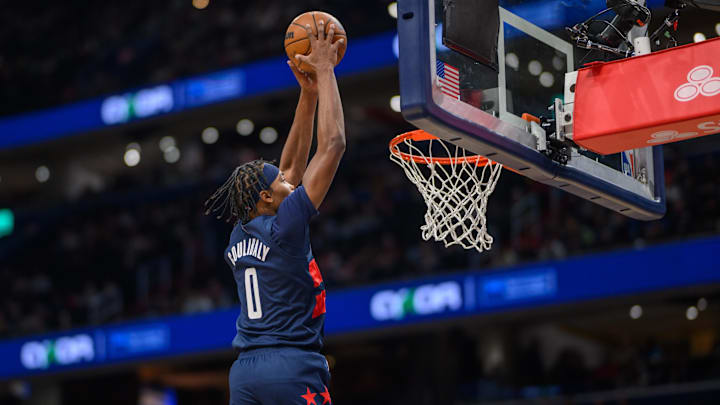Oct 26, 2024; Washington, District of Columbia, USA; Washington Wizards guard Bilal Coulibaly (0) dunks the ball during the first quarter against the Cleveland Cavaliers at Capital One Arena. Mandatory Credit: Reggie Hildred-Imagn Images