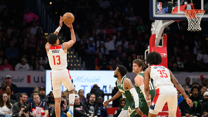 Apr 2, 2024; Washington, District of Columbia, USA; Washington Wizards guard Jordan Poole (13) takes a shot against the Milwaukee Bucks during the first quarter at Capital One Arena. Mandatory Credit: Reggie Hildred-Imagn Images