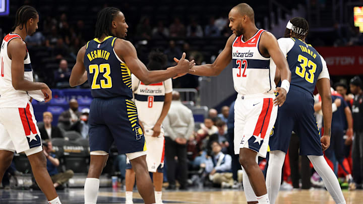 Mar 27, 2025; Washington, District of Columbia, USA; Washington Wizards forward Khris Middleton (32) and Indiana Pacers forward Aaron Nesmith (23) greet each other before a game at Capital One Arena. Mandatory Credit: Daniel Kucin Jr.-Imagn Images
