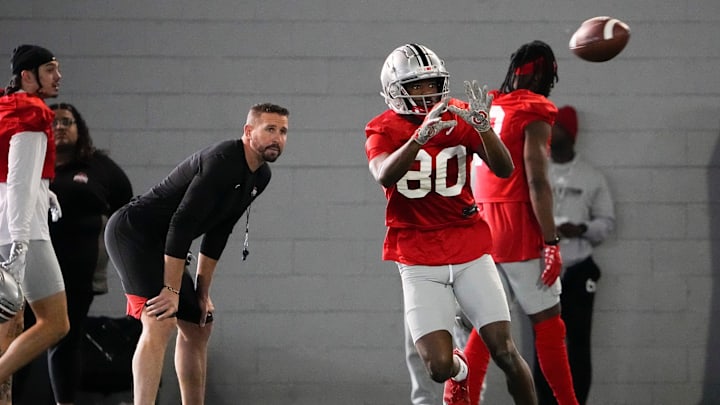 Mar 9, 2023; Columbus, Ohio, USA;  Ohio State Buckeyes offensive coordinator Brian Hartline watches