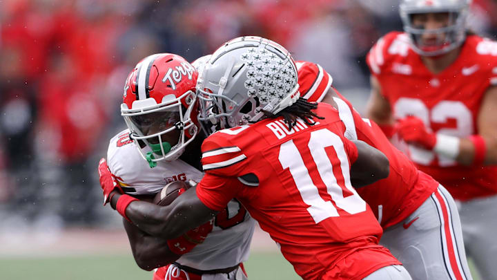 Oct 7, 2023; Columbus, Ohio, USA;  Maryland Terrapins wide receiver Tai Felton (10) runs the ball as Ohio State Buckeyes cornerback Denzel Burke (10) makes the tackle during the second quarter at Ohio Stadium. Mandatory Credit: Joseph Maiorana-USA TODAY Sports