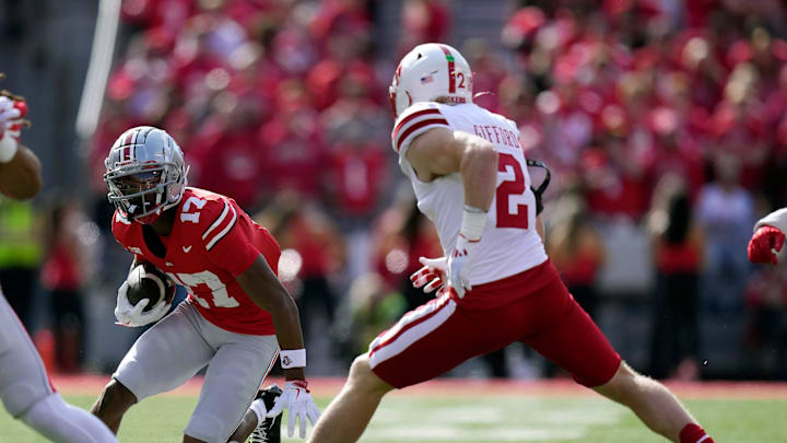 Ohio State Buckeyes wide receiver Carnell Tate (17) heads up field against Nebraska Cornhuskers defensive back Isaac Gifford (2) after a catch during the first quarter of their game at Ohio Stadium on Oct 26, 2024, in Columbus.