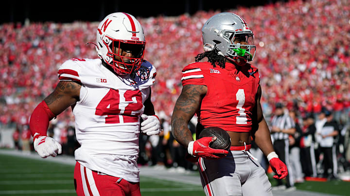 Ohio State Buckeyes running back Quinshon Judkins (1) scores a touchdown on a catch against Nebraska Cornhuskers linebacker Mikai Gbayor (42) during the fourth quarter of their game at Ohio Stadium on Oct 26, 2024, in Columbus.