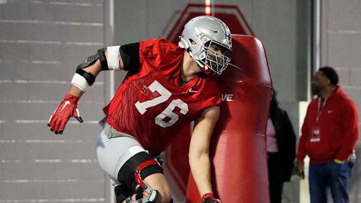 Mar 9, 2023; Columbus, Ohio, USA;  Ohio State Buckeyes offensive lineman Miles Walker hits a tackling dummy during spring football practice at the Woody Hayes Athletic Center. Mandatory Credit: Adam Cairns-The Columbus Dispatch

Football Buckeyes Spring Football