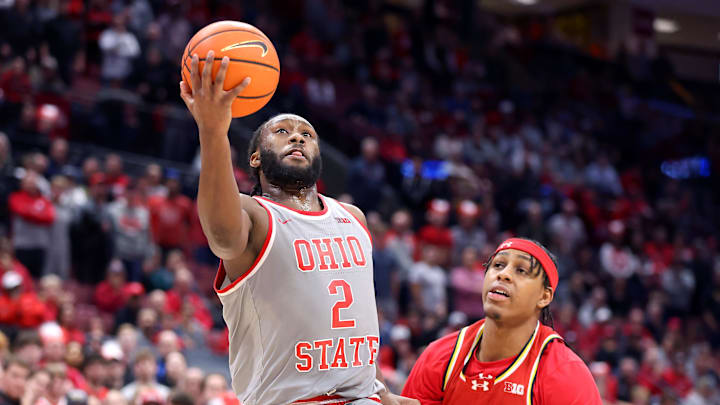 Feb 6, 2025; Columbus, Ohio, USA;  Ohio State Buckeyes guard Bruce Thornton (2) drives for a basket against Maryland Terrapins guard DeShawn Harris-Smith (5) during the second half at Value City Arena. Mandatory Credit: Joseph Maiorana-Imagn Images