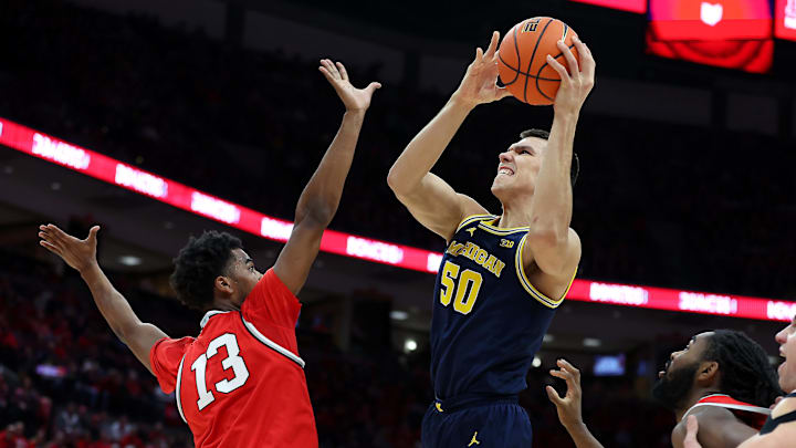 Feb 16, 2025; Columbus, Ohio, USA;  Michigan Wolverines center Vladislav Goldin (50) shoots the ball over Ohio State Buckeyes forward Sean Stewart (13) during the first half at Value City Arena. Mandatory Credit: Joseph Maiorana-Imagn Images