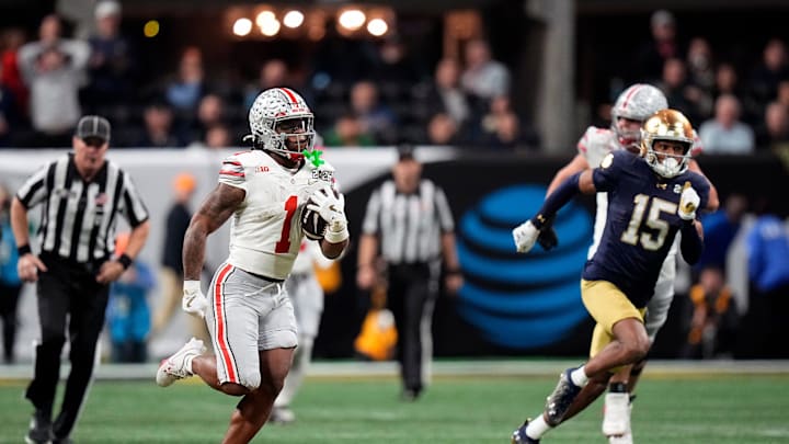 Ohio State Buckeyes running back Quinshon Judkins (1) gets away from the Notre Dame Fighting Irish defense for a long run in the third quarter during the College Football Playoff championship at Mercedes-Benz Stadium in Atlanta on January 20, 2025.
