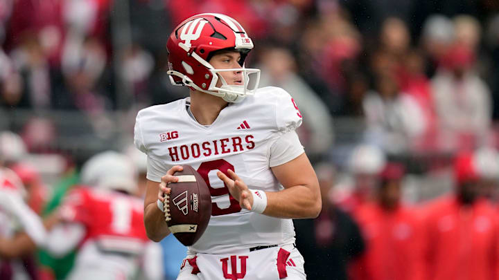 Indiana Hoosiers quarterback Kurtis Rourke (9) drops back to pass against Ohio State Buckeyes defense during the second quarter of the football game in Columbus on Saturday, Nov. 23, 2024.