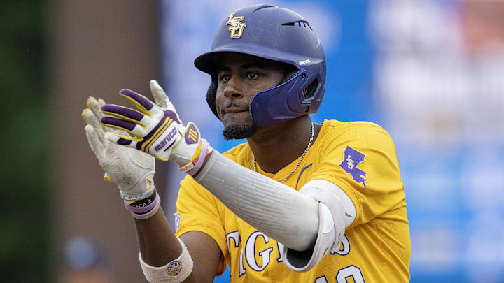 Jun 2, 2024; Chapel Hill, NC, USA;  Louisiana State Tigers infielder Michael Braswell III (10) reacts to getting a base hit against the North Carolina Tar Heels during the Div. I NCAA baseball regional at Boshamer Stadium.  Mandatory Credit: Jeffrey Camarati-Imagn Images

