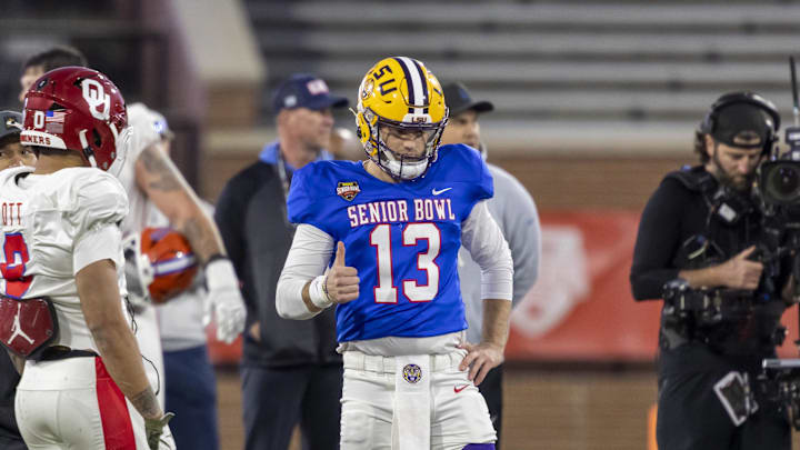 Jan 28, 2026; Mobile, AL, USA; American Team quarterback Garrett Nussmeier (13) of LSU gives a thumbs up during American Senior Bowl practice at Hancock Whitney Stadium. Mandatory Credit: Vasha Hunt-Imagn Images