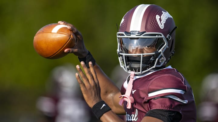 Lawrence Central High School junior Terry Walker III (3) warms up on the field before the start of an IHSAA varsity football game against Lawrence North High School.