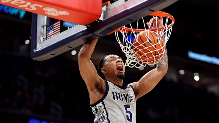 Feb 19, 2025; Washington, District of Columbia, USA; Georgetown Hoyas guard Micah Peavy (5) dunks during the first half against the Providence Friars at Capital One Arena. Mandatory Credit: Daniel Kucin Jr.-Imagn Images