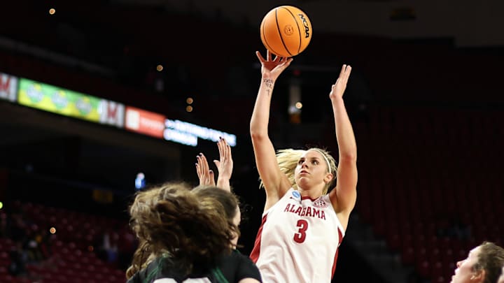 Mar 22, 2025; College Park, Maryland, USA; Alabama Crimson Tide guard Sarah Ashlee Barker (3) takes a shot over Green Bay Phoenix center Jenna Guyer (30) during the first half at Xfinity Center. Mandatory Credit: Daniel Kucin Jr.-Imagn Images