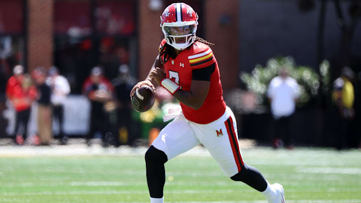 Aug 30, 2025; College Park, Maryland, USA; Maryland Terrapins quarterback Malik Washington (7) runs with the ball during the first half against the Florida Atlantic Owls at SECU Stadium. Mandatory Credit: Daniel Kucin Jr.-Imagn Images