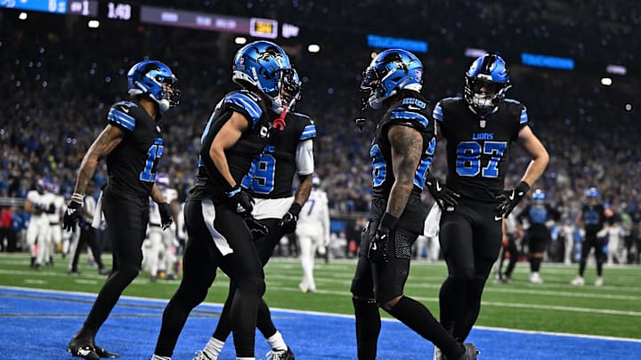 Jan 5, 2025; Detroit, Michigan, USA; Detroit Lions running back Jahmyr Gibbs (26) celebrates with wide receivers Amon-Ra St. Brown (14), Tim Patrick (17) and Jameson Williams (9) and tight end Sam LaPorta (87) in the end zone after running for a touchdown against the Minnesota Vikings in the first quarter at Ford Field. Mandatory Credit: Lon Horwedel-Imagn Images