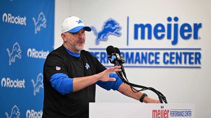 Jul 28, 2025; Allen Park, MI, USA;  Detroit Lions offensive coordinator John Morton talks with the media before the Lions take the field for practice at Meijer Performance Center. Mandatory Credit: Lon Horwedel-Imagn Images