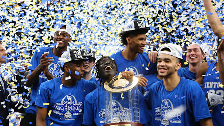 Mar 11, 2018; St. Louis, MO, USA; The Kentucky Wildcats celebrate with the championship trophy after defeating the Tennessee Volunteers in the SEC Conference Tournament Championship game at Scottrade Center. Kentucky won 77-72. Mandatory Credit: Billy Hurst-Imagn Images
